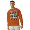 Man wearing an orange sweatshirt with graphic designs on a white background
