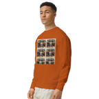 Person wearing an orange sweatshirt with graphic design on a white background
