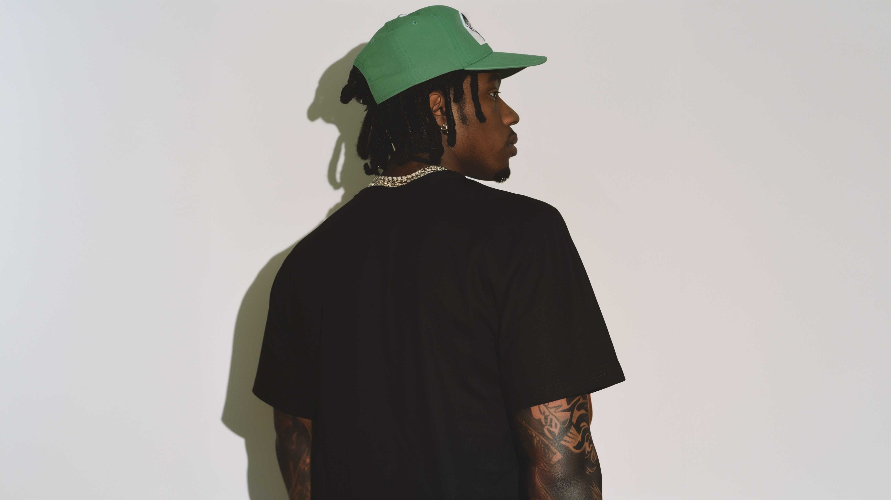 guy in green hat with black tee