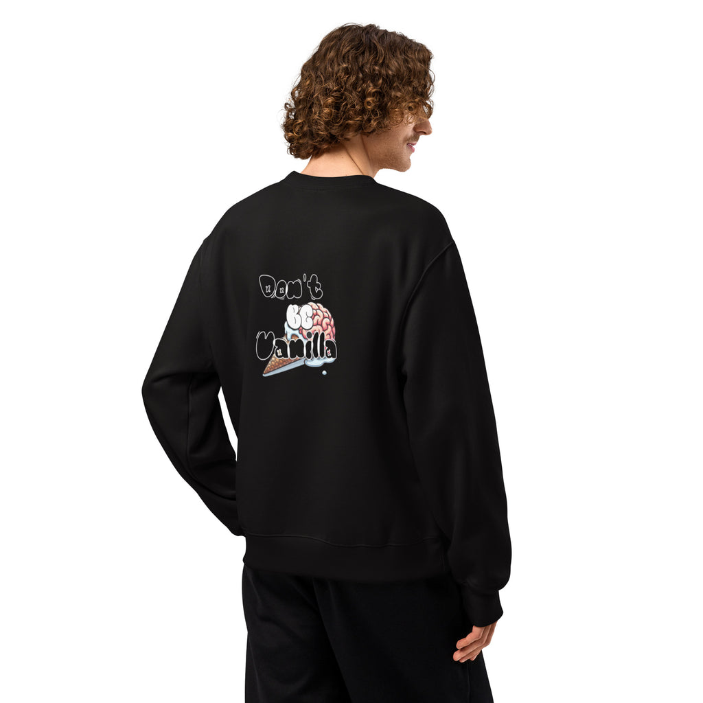 Person wearing a black sweatshirt with text and graphics on the back, standing against a white background