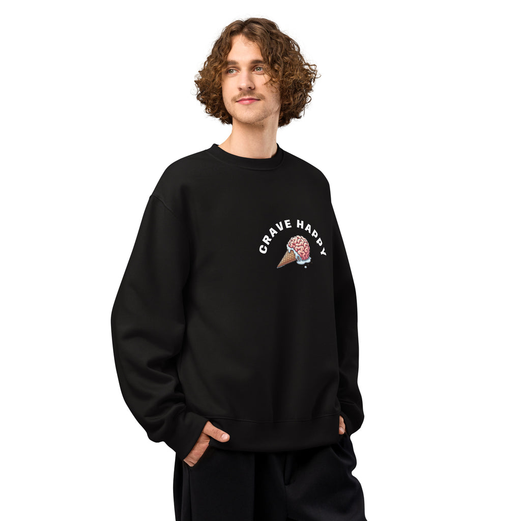 Person wearing a black sweatshirt with a graphic design and text on a white background