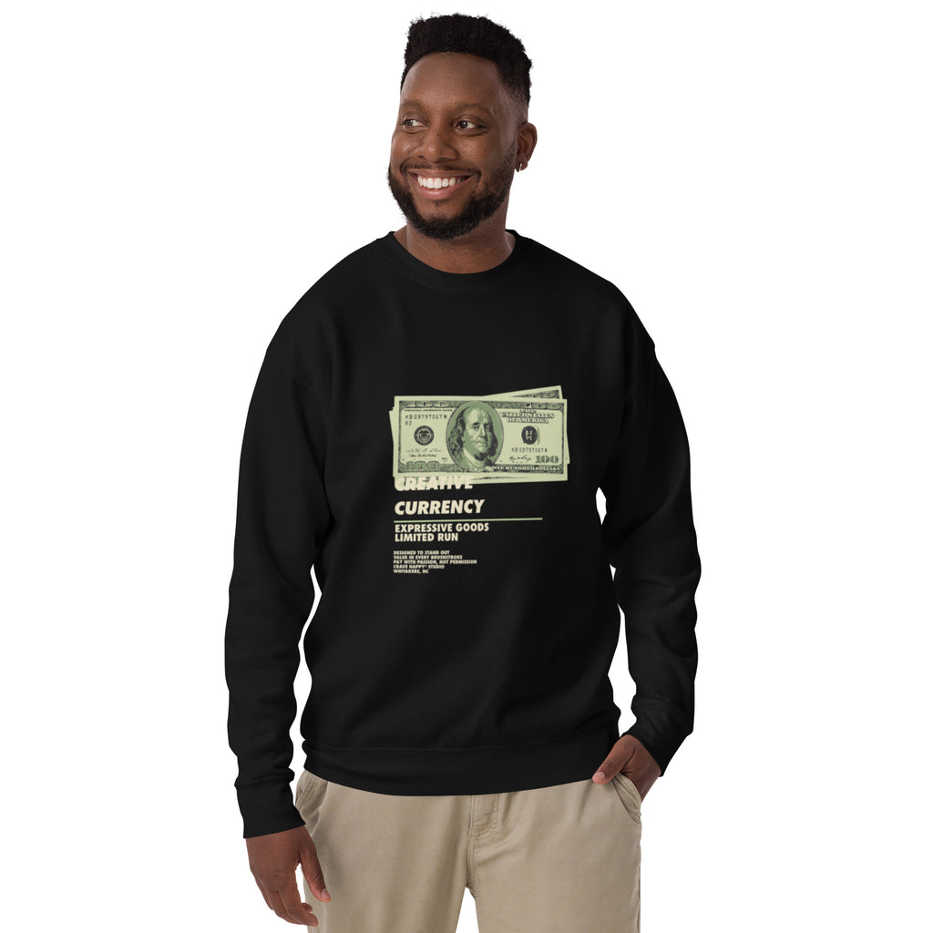 Man wearing a black sweatshirt with a dollar bill graphic and text.