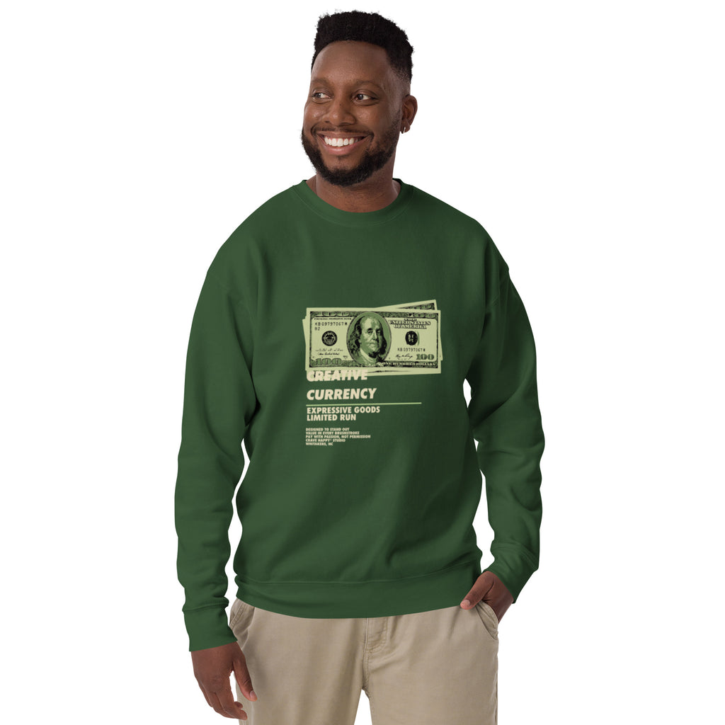 Man wearing a green sweatshirt with a dollar bill design on a white background